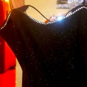 Gorgeous black with small shimmers of silver with rhinestone trim Fits sz 0 to 5